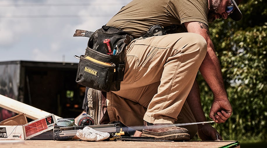 Person wearing romeo boot while working