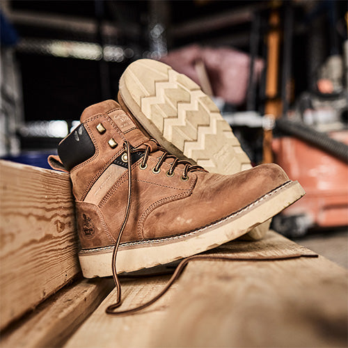 Georgia Boots sitting on wood beams