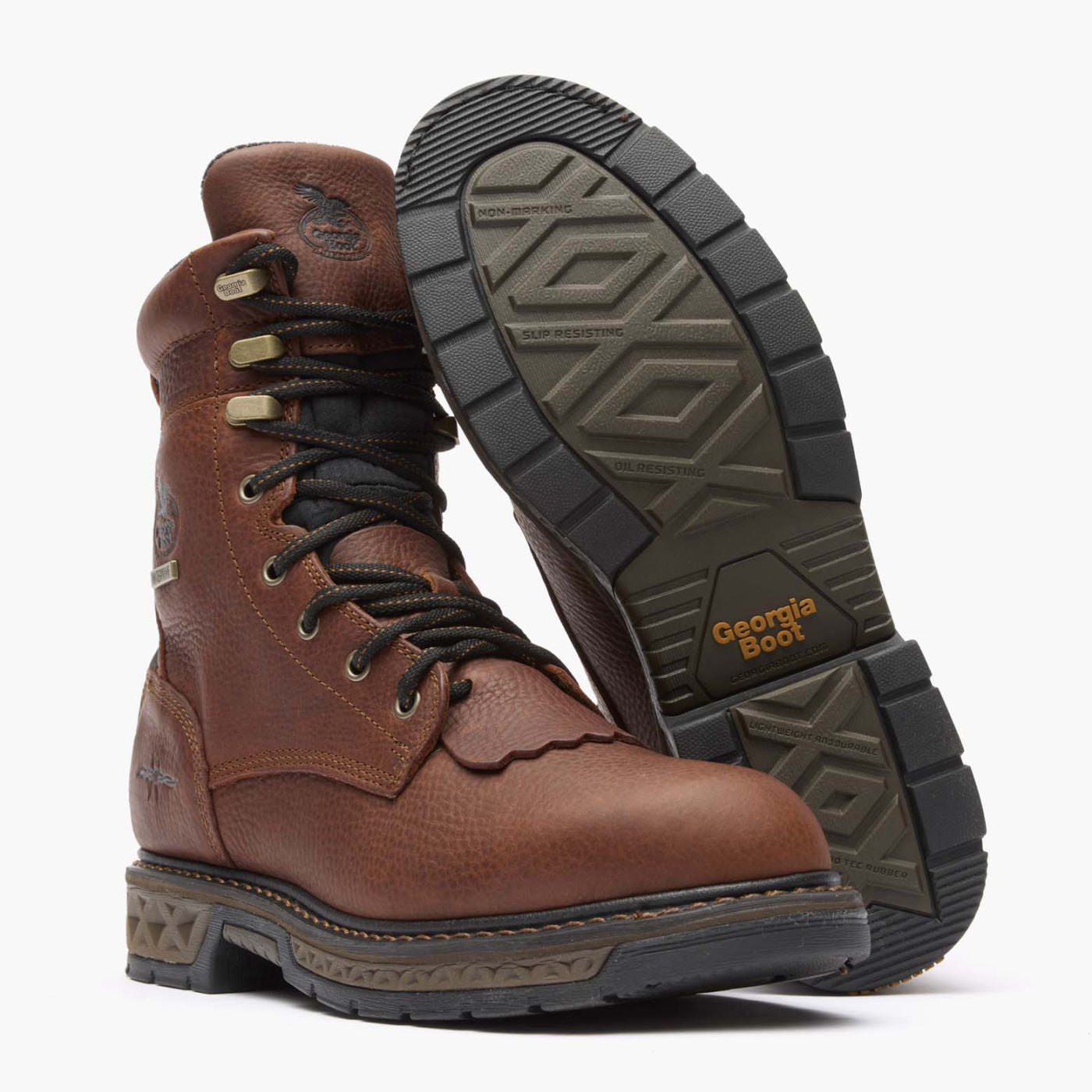 Brown boot with black sole on a white background