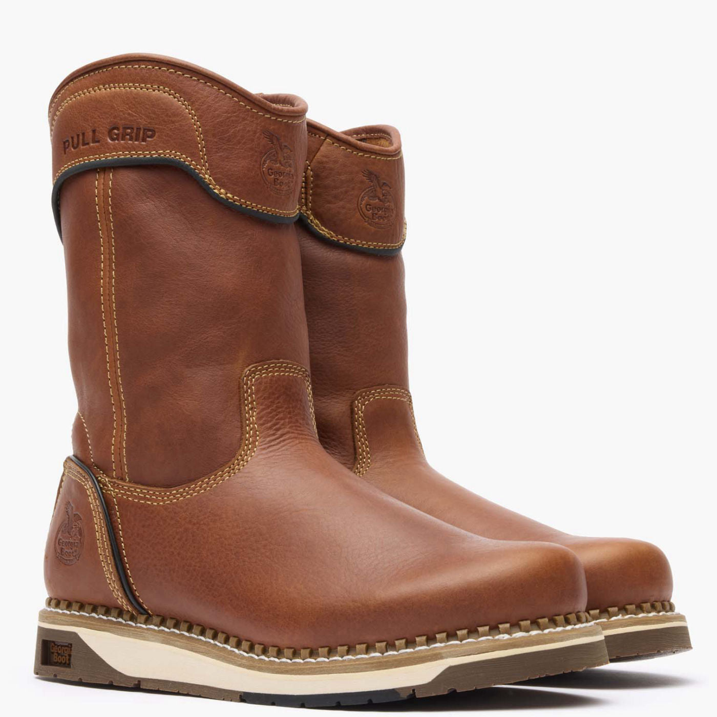 Pair of brown leather boots with 'BullGrip' branding on a white background
