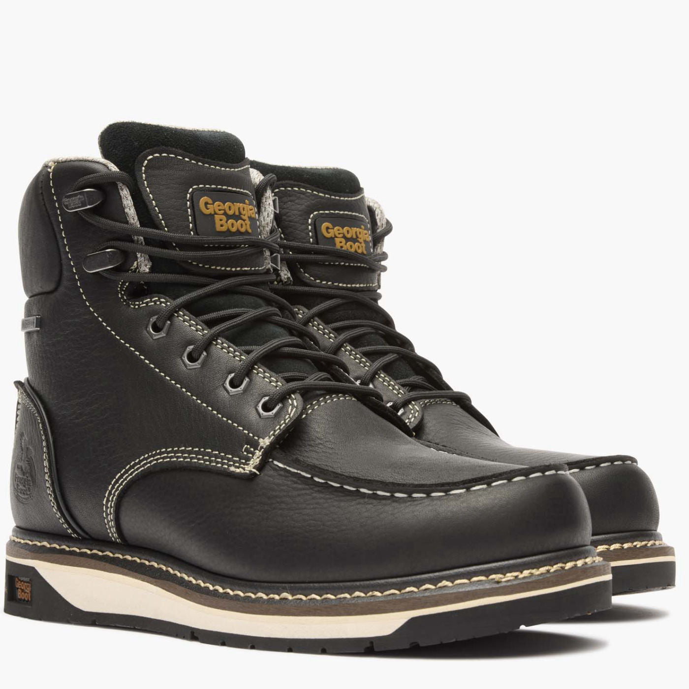 Pair of black leather boots with visible branding on a white background