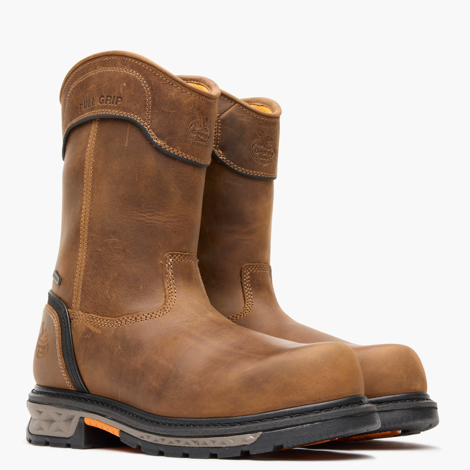 Pair of brown work boots on a white background
