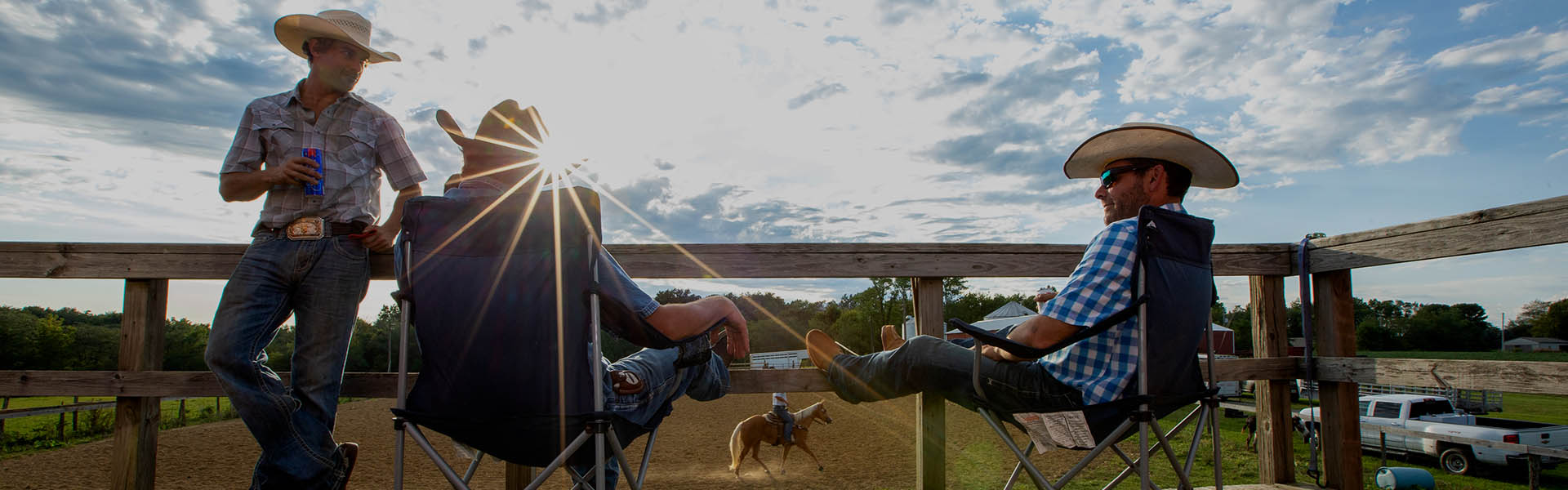 Ranchers sitting around a farm