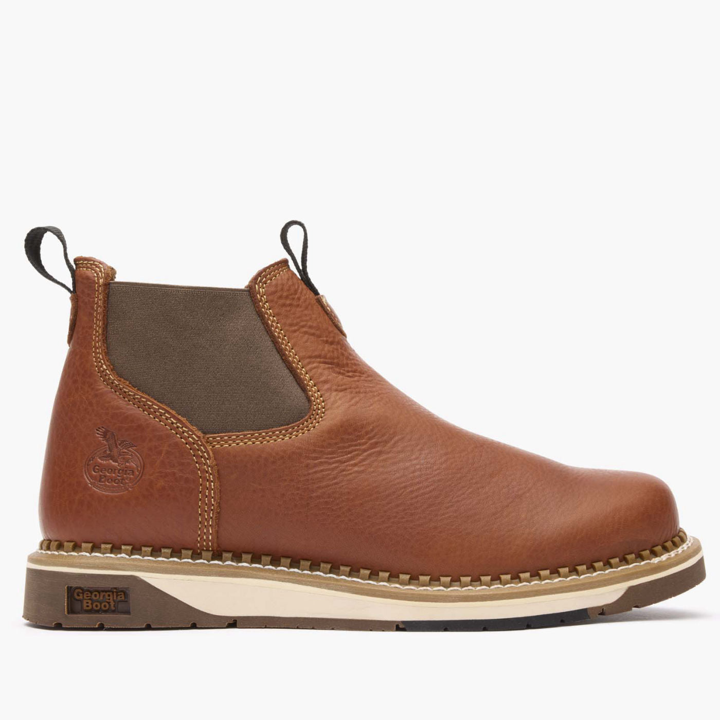 Brown leather boot with a white sole on a light gray background